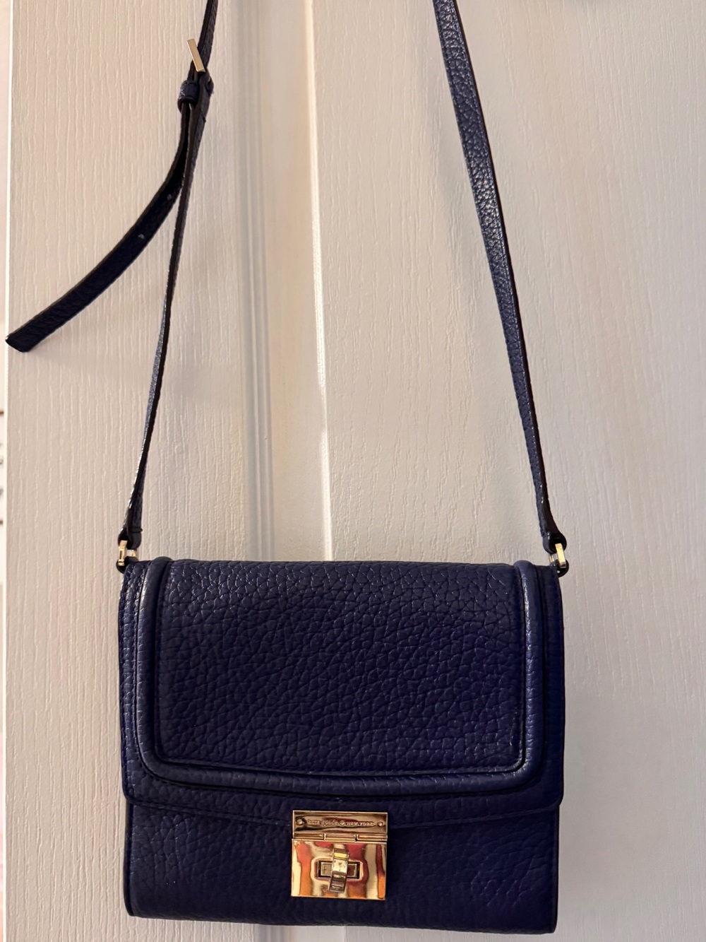 kate spade navy pebbled leather crossbody with gold hardware
